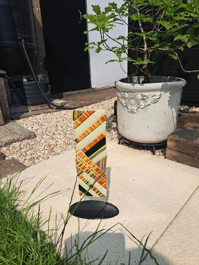 Contemporary glass art in stand