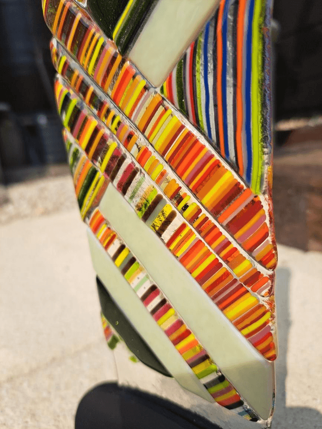 Contemporary glass art in stand