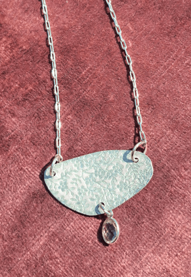 Floral silver & quartz pendant