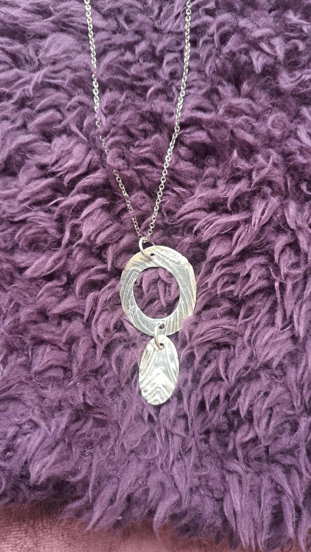 Oval double silver pendant