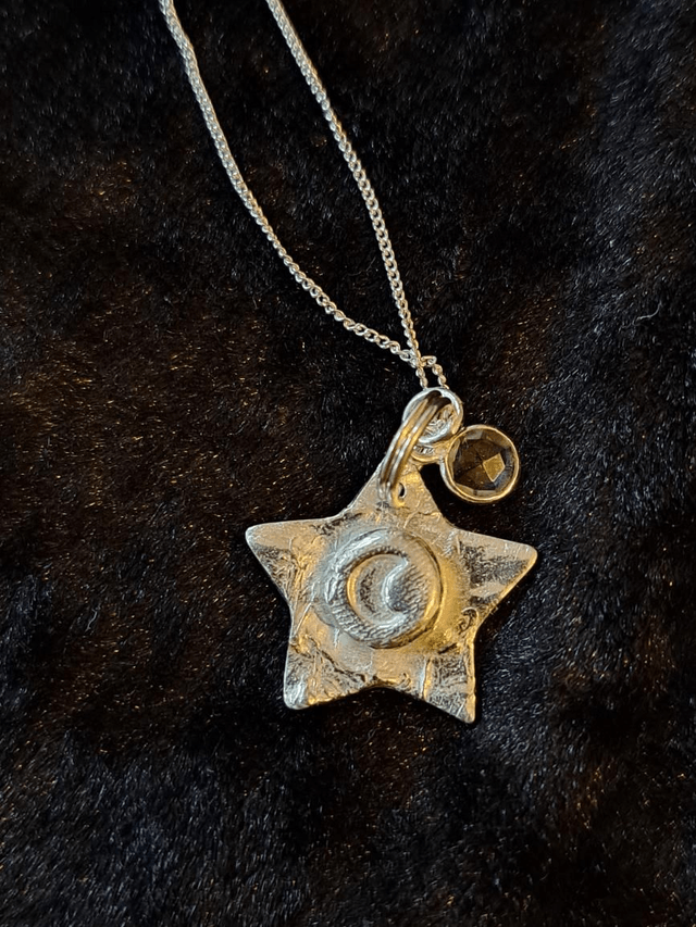 Silver Star and moon pendant with quartz charm