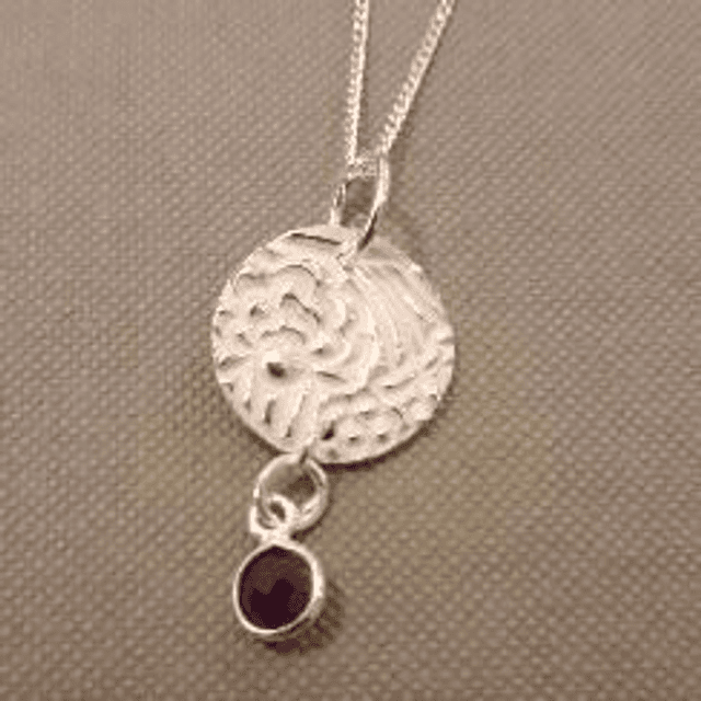 Silver and amethyst pendant