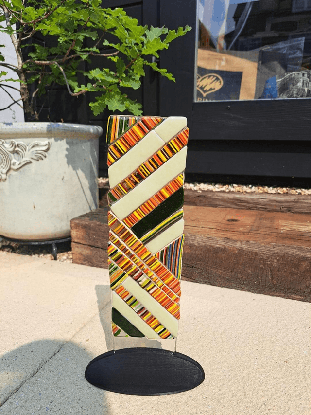 Contemporary glass art in stand
