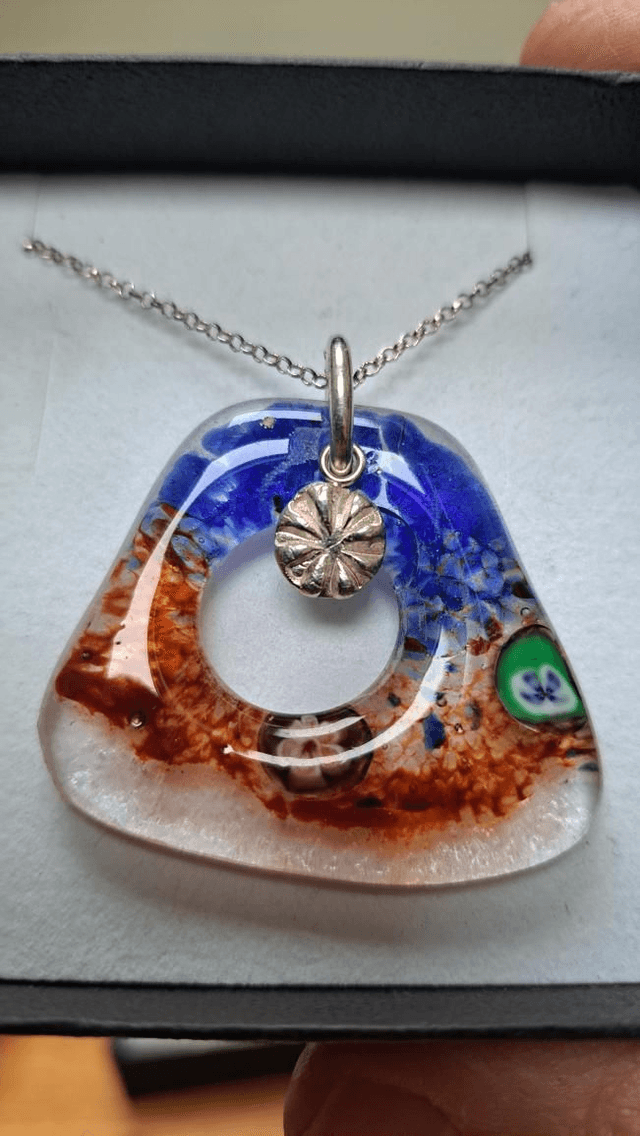 Abstract fused glass with silver poppy head 